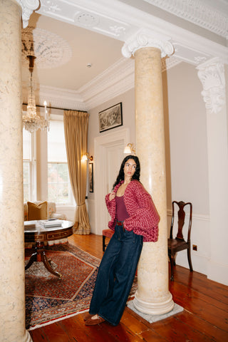 ピンクのコロッサルニットカーディガン